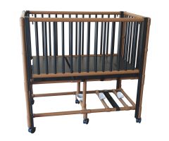Wood tone pediatric crib bed with adjustable side rails O2 tank holder 